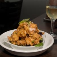 Rock and Roll Shrimp · Crispy shrimp mixed with tomatoes and scallions in creamy Sriracha and wine sauce. Served wi...