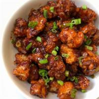 Gobi Manchurian · Cubes of cauliflower stir fried with fresh hot chilies, spring onion and Manchurian sauce. V...