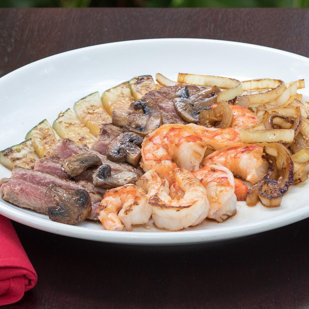 Steak & Shrimp Family Meal · Hibachi steak and grilled shrimp lightly seasoned and grilled to your specification. Available for 2, 4 or 6! Served with, Benihana salad, Hibachi vegetables, Homemade dipping sauces, Hibachi chicken rice.