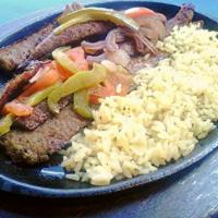Gyros Skillet (Fajita style) · Fajita style. Served with sautéed onions, green peppers tomatoes and  served with rice or fr...