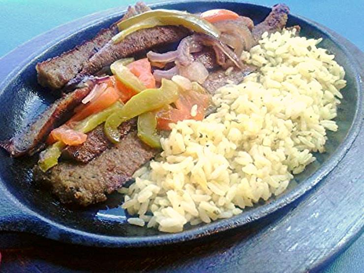 Gyros Skillet (Fajita style) · Fajita style. Served with sautéed onions, green peppers tomatoes and  served with rice or fries, pita and small Athenian salad.