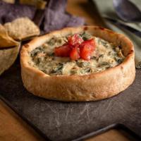 Spinach and Artichoke Dip · A housemade blend of creamy spinach and artichokes topped with
seasoned diced tomatoes. Serv...