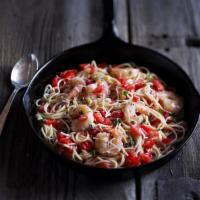 Shrimp Scampi · Shrimp sauteed with garlic, diced tomatoes, and basil in a white wine sauce on thin spaghett...