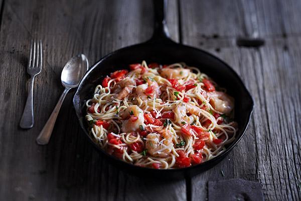 Shrimp Scampi · Shrimp sauteed with garlic, diced tomatoes, and basil in a white wine sauce on thin spaghetti with Parmesan.