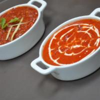 62. Chicken Tikka Masala · Clay oven grilled chicken breast pieces cooked in special tikka masala sauce, garnished with...