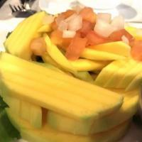 Fresh Mango Salad · Fresh cut mango with tomato, onion and shrimp paste.