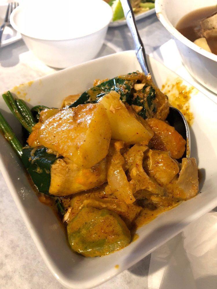 Chicken Curry · Chicken cooked in a curry sauce with coconut milk. Served with rice.