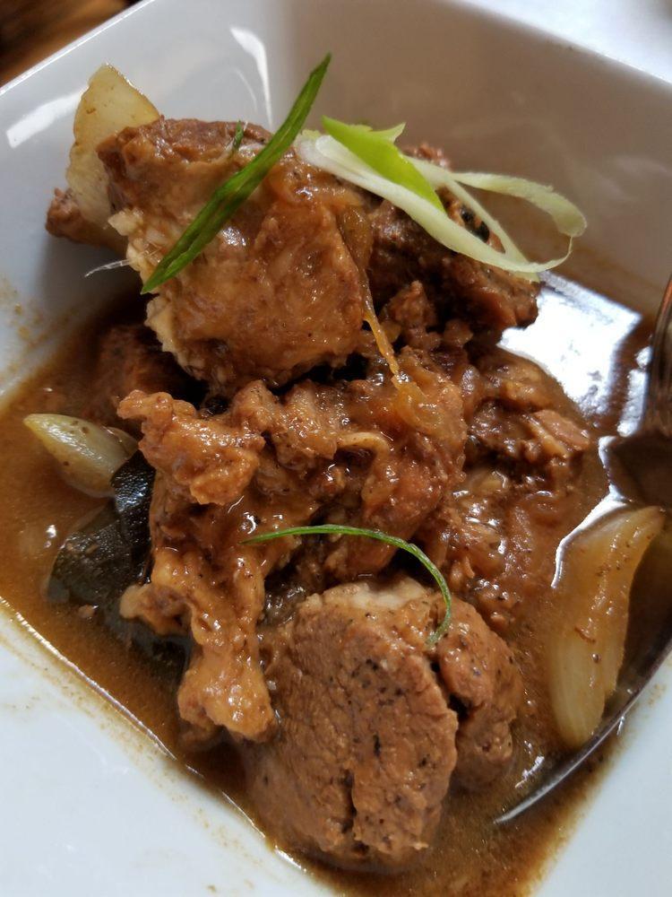 Beef Adobo · Beef braised in soy sauce, vinegar and garlic. Served with rice.