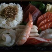 Chirashi · Assorted raw fish on a bed of seasoned rice. 