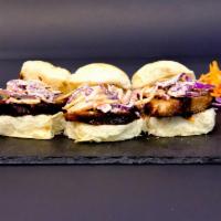 El Hawaiian Sandwich · Crispy pork luau, hoisin and Rocoto slaw on Hawaiian rolls.