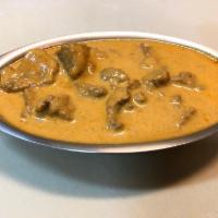 Rogan Josh · Boneless lamb specially cooked with ginger, garlic, herbs, and tasty spices.