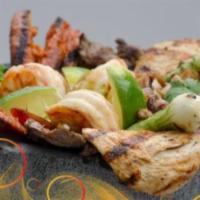 Signature Dish Molcajete Excelencia · Grilled chicken, steak, chorizo, pork, fried cheese and shrimp in a traditional molcajete se...