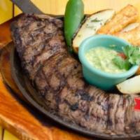 Churrasco Excelencia · Marinated grilled steak served with baked potato and fried cheese. Comes with rice and beans...