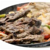 Sizzling Skillet Fajitas · Sauteed onions, red peppers, green peppers, melted Monterey jack cheese, served with flour t...