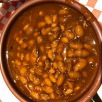 Meaty Baked Beans · Meat Trimmings, BBQ Sauce, Molasses.. Need we say more.