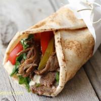 Beef Wrap · A delicious wrap with fresh tomatoes, onion, parsley and pickle flavored with tahine and gar...