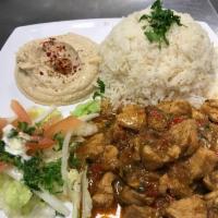 Curry Chicken Stew served with white rice, hummus and salad. · Chicken With Curry Sauce. This chicken breast is flavored with a creamy sauce made with curr...