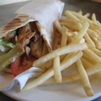 Combo: Gyro wrap + fries or hummus or salad + soda · A gyro or gyros is a Greek dish made from lamb meat cooked in a vertical rotisserie. Like sh...