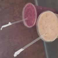 Fruitti Tutti Smoothie · Fresh orange juice, pineapple, bananas, strawberries and non fat frozen yogurt. 