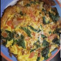 Vegetarian Frittata · Pan-fried omelette with broccoli, mushrooms, carrots and zucchini. Served with potatoes and ...