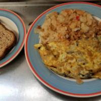 Swiss and Mushroom Omelette · Served with potatoes and toast. Made with fresh country eggs.
