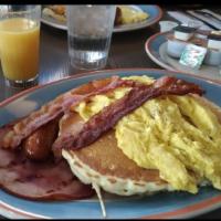 Lumber Jack · Pancakes with 2 eggs any style, 2 strips of bacon, 1 sausage and ham.