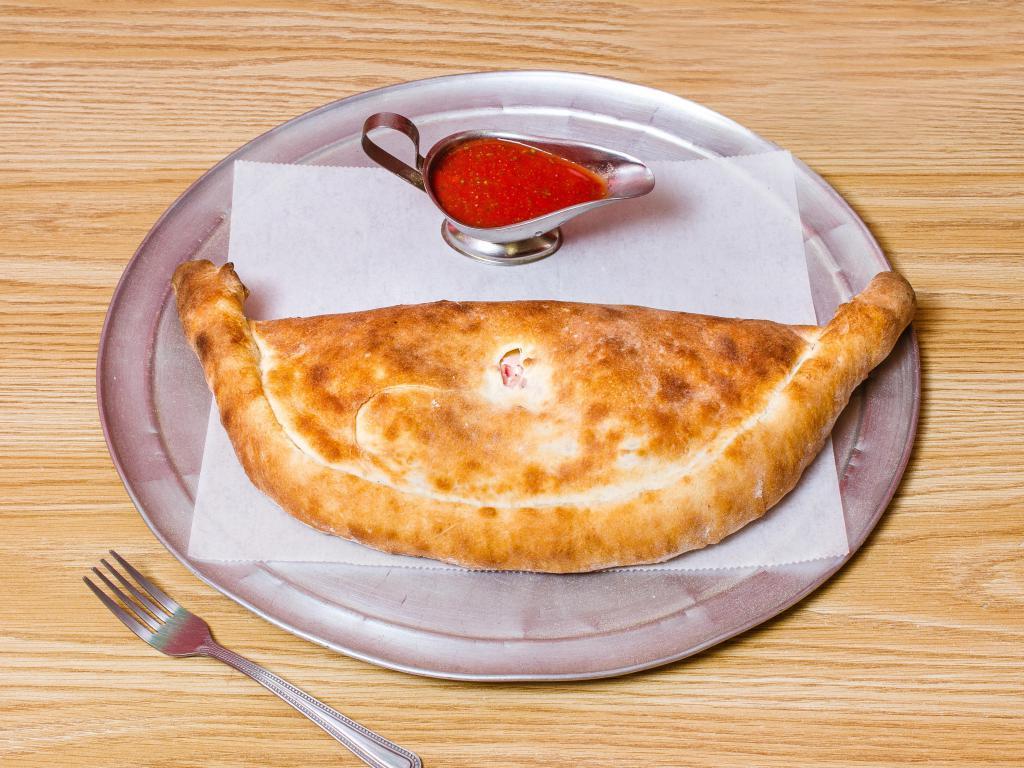 Calzone · Comes with ricotta cheese, mozzarella and 1 pizza topping.