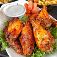 Habanero Wings · A spicy habanero sauce heats up these grilled chicken wings. Served with carrots and ranch d...