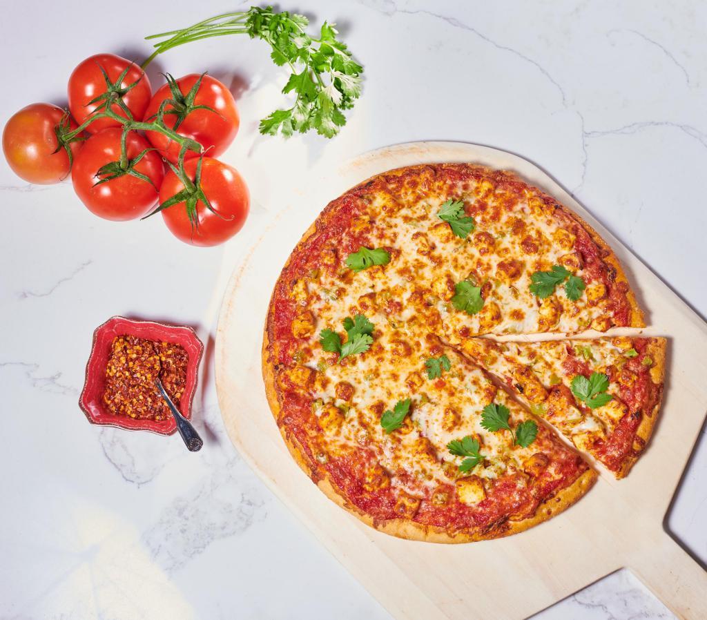 Chilifornia Pizza · Bell peppers, fresh cilantro and your choice of eggplant, paneer or chicken on an organic chilifornia base. Eggplant option has red onions in place of bell peppers. Comes with premium cheese.