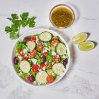Greek Salad · Crisp romaine, cucumbers, cherry tomatoes, mediterranean olive-mix and feta.