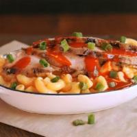 Buffalo Chicken Mac Stack · Spicy Buffalo Chicken with creamy Mac and Cheese topped with green onions