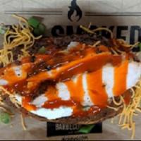 Buffalo Chicken Baker · Giant Baker with buffalo sauce, smoked chicken, sour cream shredded cheese, and green onion