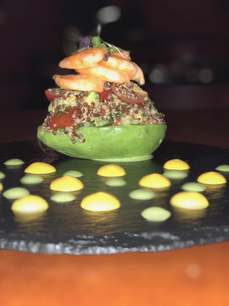 5. Palta Rellena · Stuffed avocado with shrimp, quinoa, cucumber, red pepper, mint, olive oil, cherry and tomatoes.
