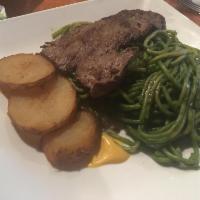 6. Tallarin Verde con Bistek · Basil and spinach, spaghetti over sirloin steak and golden potatoes.