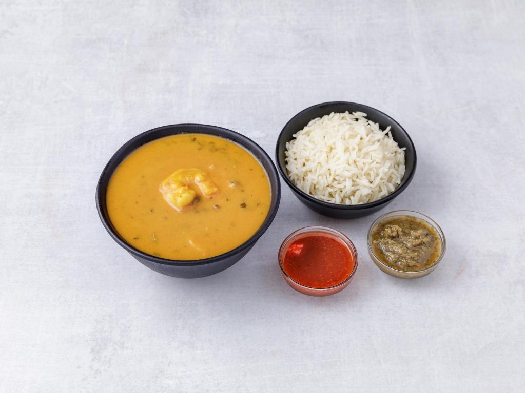 Shrimp Curry · Shrimp cooked in three mildly spiced sauces. Served with rice and chutneys. 