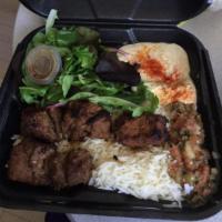Lamb Shish Kebab  Plate · All-natural New Zealand lamb leg kebab, house mix, rice, salad, and 1 side. Gluten-free. (ha...