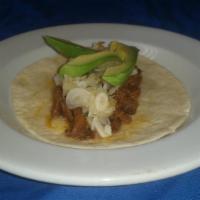 Carnitas Taco · Pulled pork with pineapple salsa and avocado.