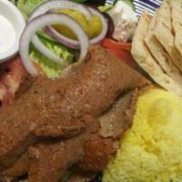 Lamb Gyro Salad · Special seasoned lamb slices on Greek salad with a side of hummus, 1 flat soft pita, and Med...