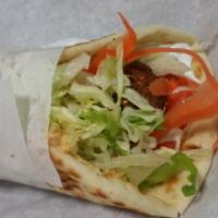 Falafel Wrap · Balls of deep fried seasoned chickpeas rolled in pita bread and served with tzatziki sauce, ...