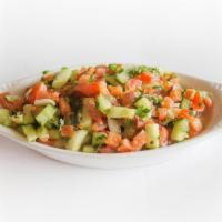Shirazi Salad · Diced tomatoes, cucumbers, onions and parsley mixed with olive oil and lemon juice.