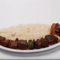 Lamb Kabob · Seasoned sirloin lamb. Include rice, grilled tomato and pita bread.