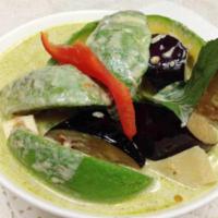 57. Avocado Chicken Curry · Green curry paste in coconut milk with avocado, sliced chicken breast, bell pepper, pea, car...