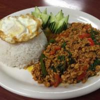 70. Ka Pao Kai Dao · Ground chicken with bell peppers, onions, garlic, chili and basil. Served with sunny egg.