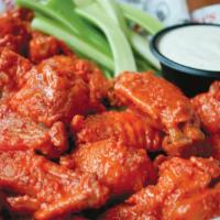 Jumbo Wings · Tossed in the sauce of your choice and served with choice of dressing.