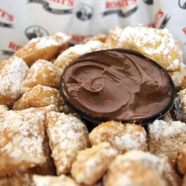 Zeppole · Bite-sized pieces of crispy dough tossed in powdered sugar and paired with rich Nutella hazelnut spread. Serves 3-4.