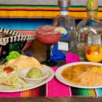 Special Mexican Plate · One beef taco, one cheese enchilada smothered in chili con carne, a tostada, guacamole, rice...