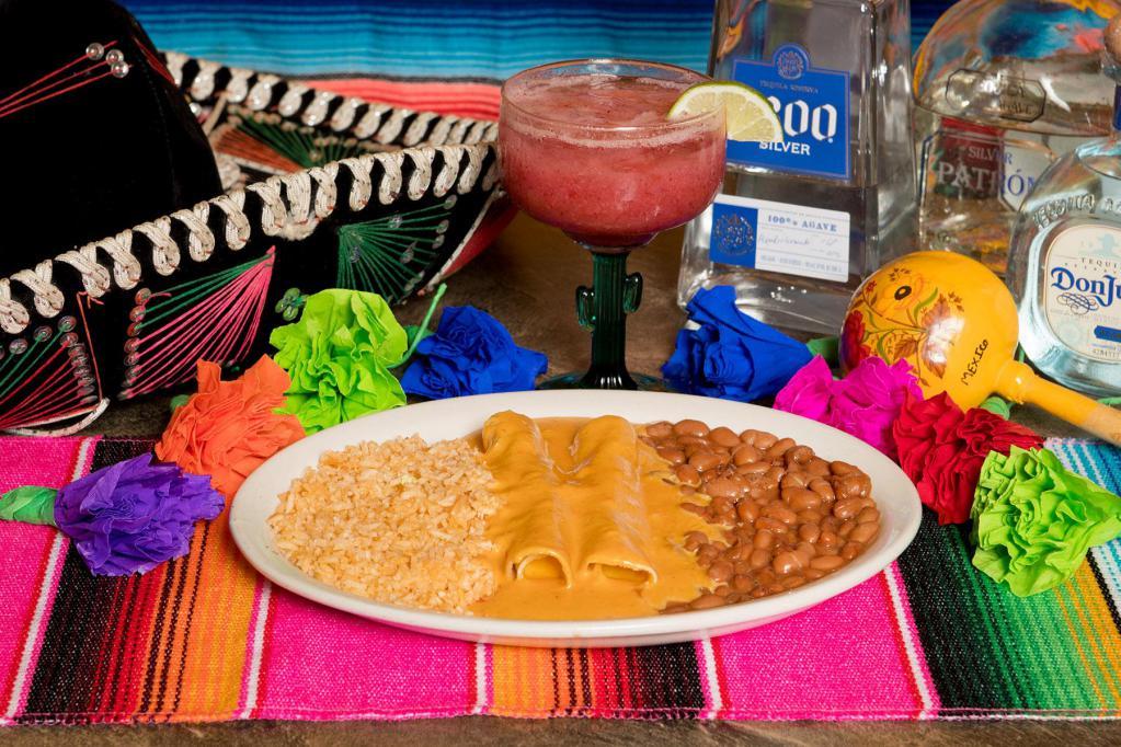 Jalisco Dinner · 2 cheese enchiladas smothered with chili con queso. Served with rice and whole beans.
