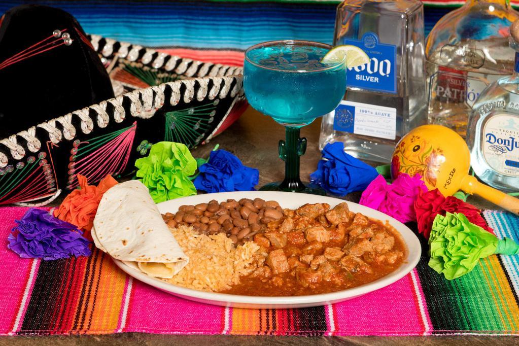 Ranchero Plate · Chile verde pork, rice, whole beans and tortillas.