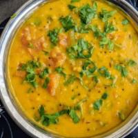 Dal Monsoon · Spicy yellow lentils. Served with basmati rice.