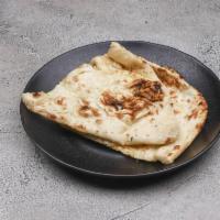 Naan · Soft textured, leavened white flour bread.